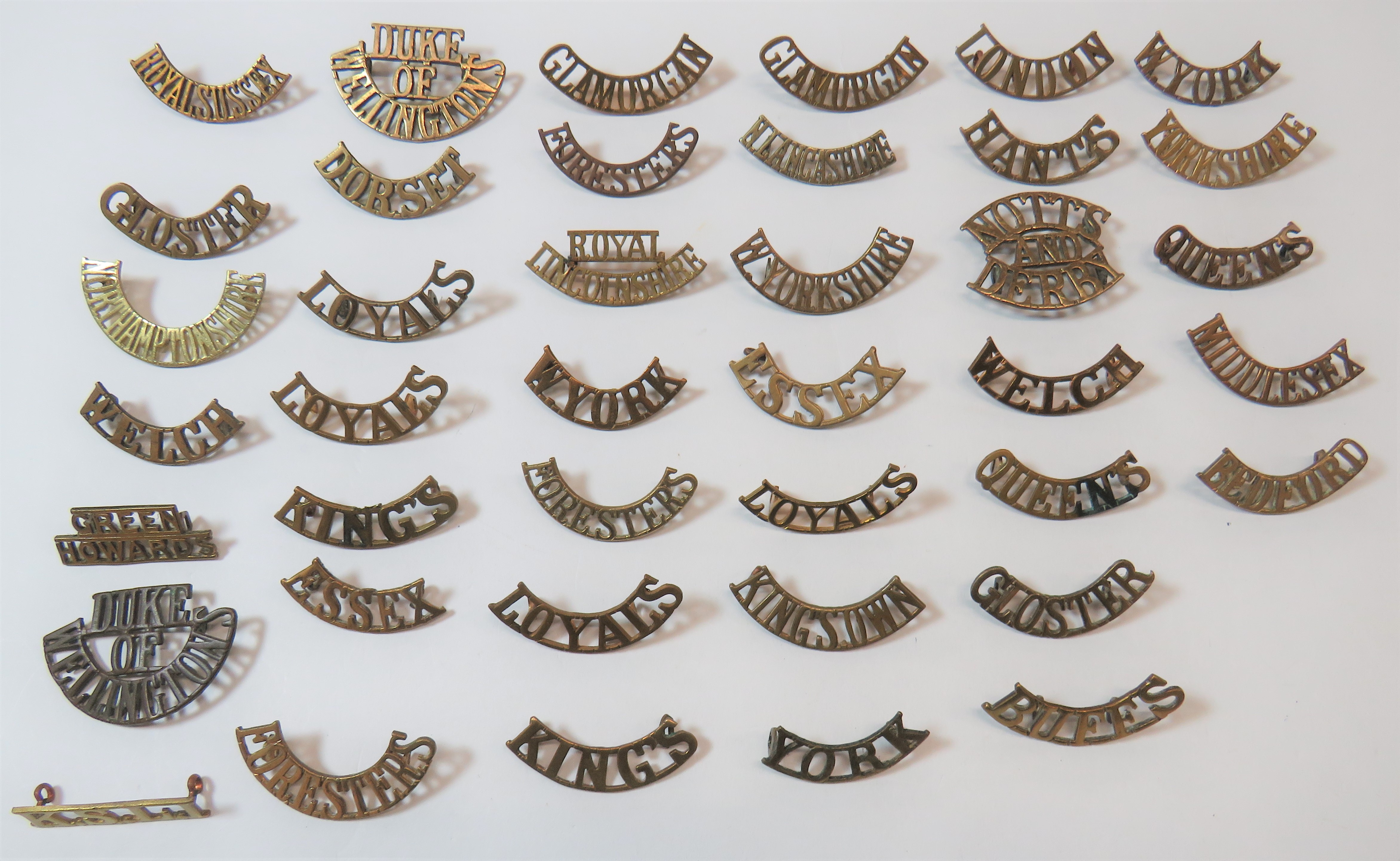 Infantry Brass Shoulder Titles including Glamorgan ... London ... Buffs ... Green Howards .. Duke of