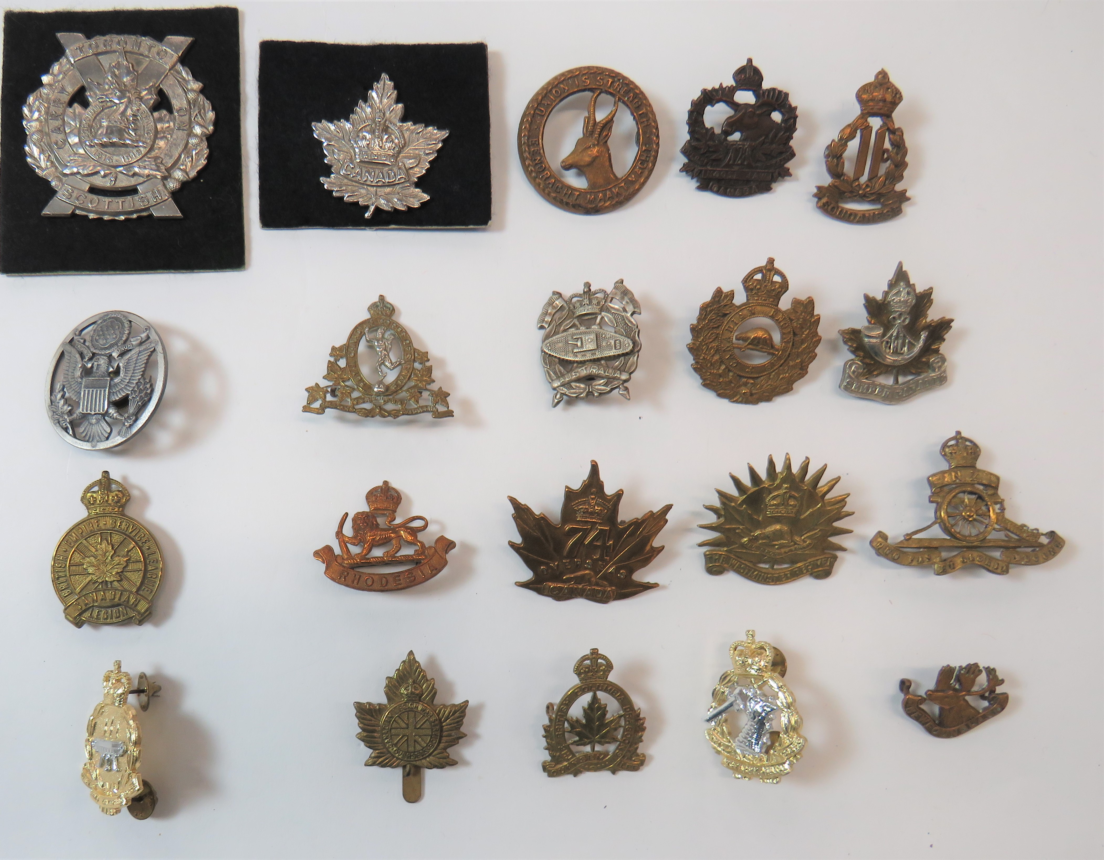 Selection of Colonial Cap Badges including darkened KC 128th Overseas Batt Moose Jaw Canada ...