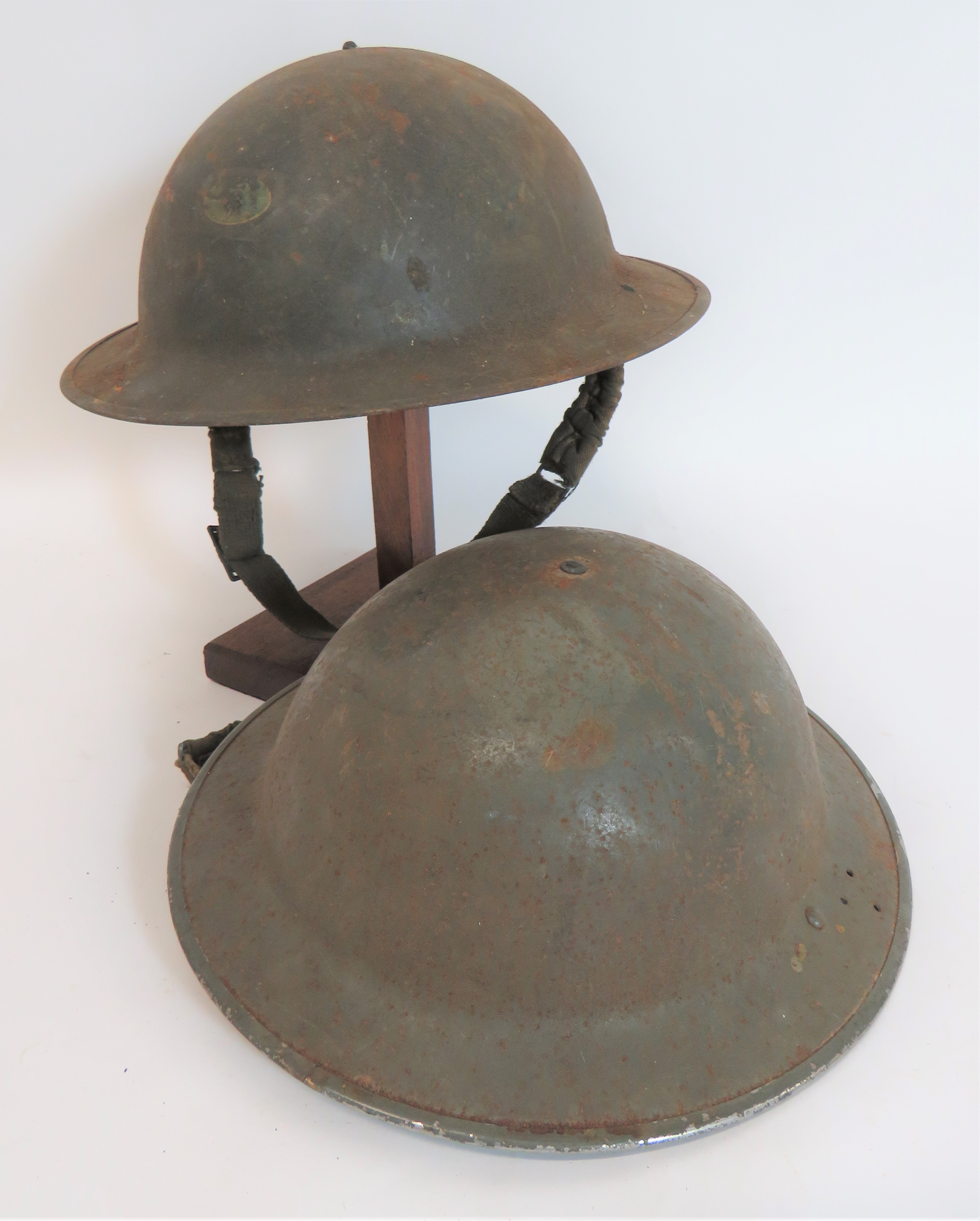 Two WW2 Civil Defence Brodie Pattern Steel Helmets grey painted crown and brim. One helmet with 3