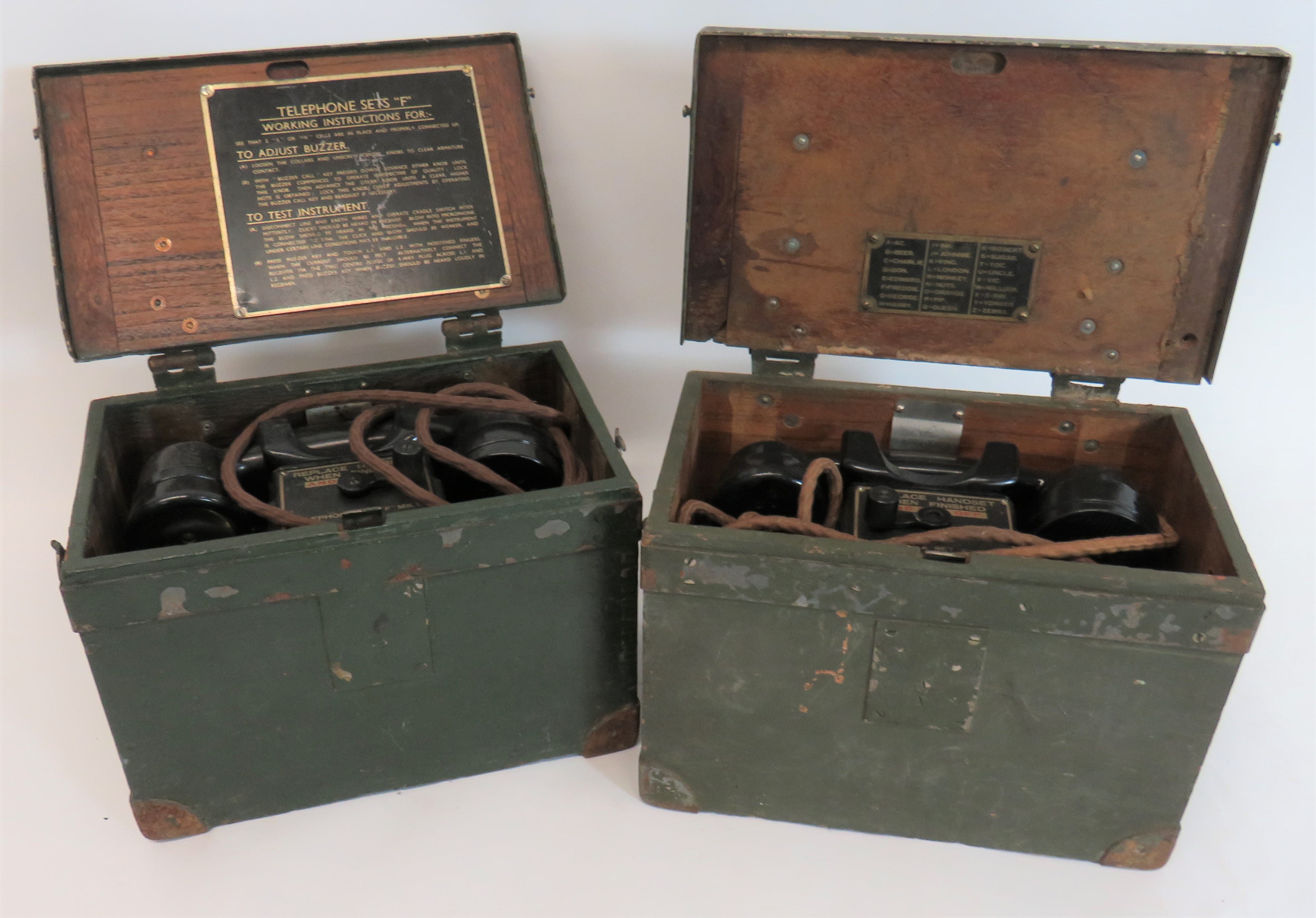 Two WW2 British Field Telephones green painted, rectangular wooden boxes with reinforced steel