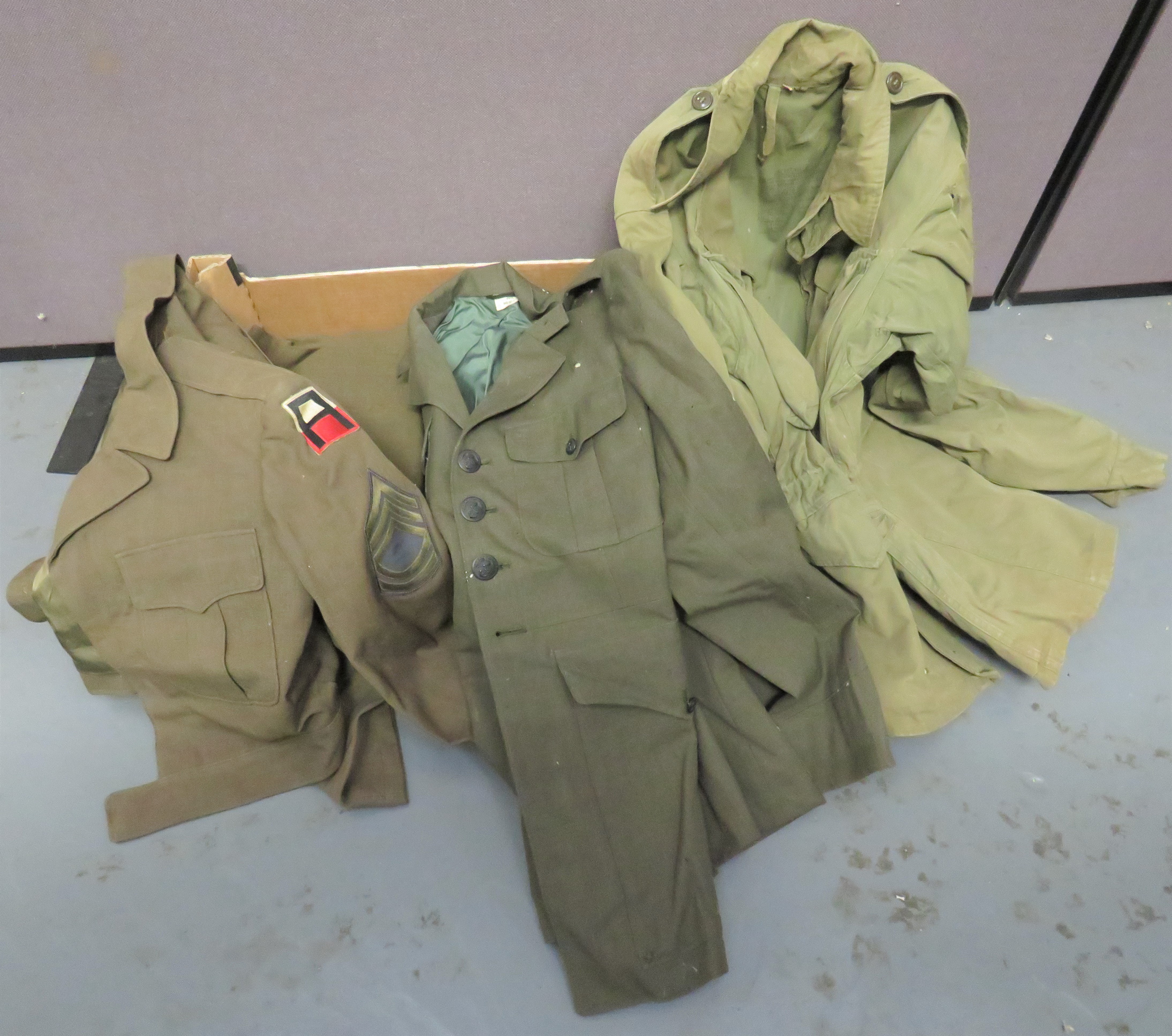 Selection Of American Uniforms consisting M1943 combat jacket.  Green cotton, single breasted