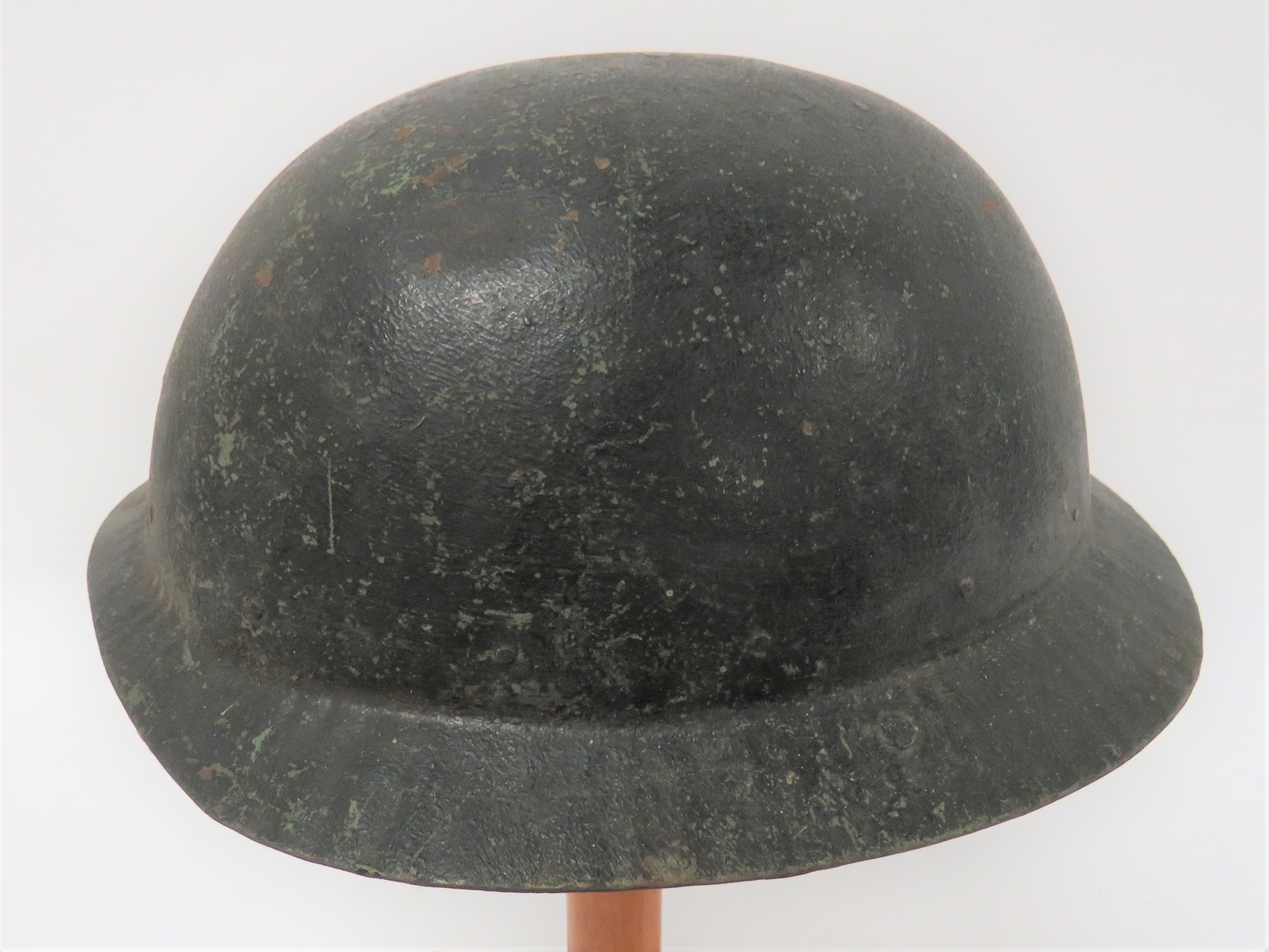 WW1 Period Private Purchase Steel Helmet black overpainted apple green crown and ribbed brim.