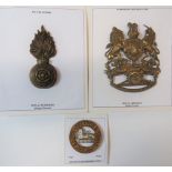 Three Various Helmet/Cap Badges consisting post 1901 Royal Artillery helmet plate.  Brass KC royal