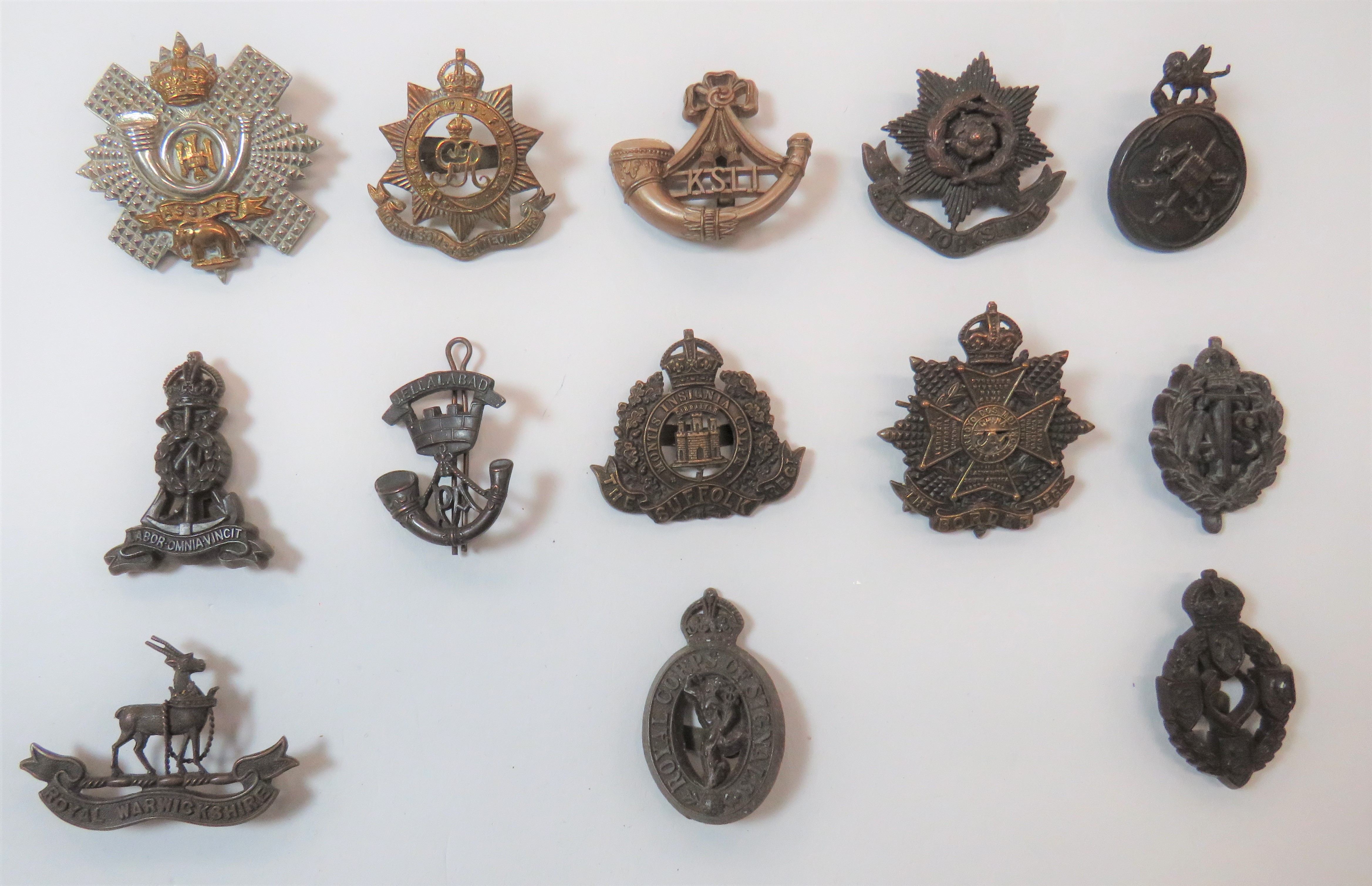 Plastic Economy And Officer Cap Badges consisting grey plastic KSLI ... Brown plastic KC ATS ...