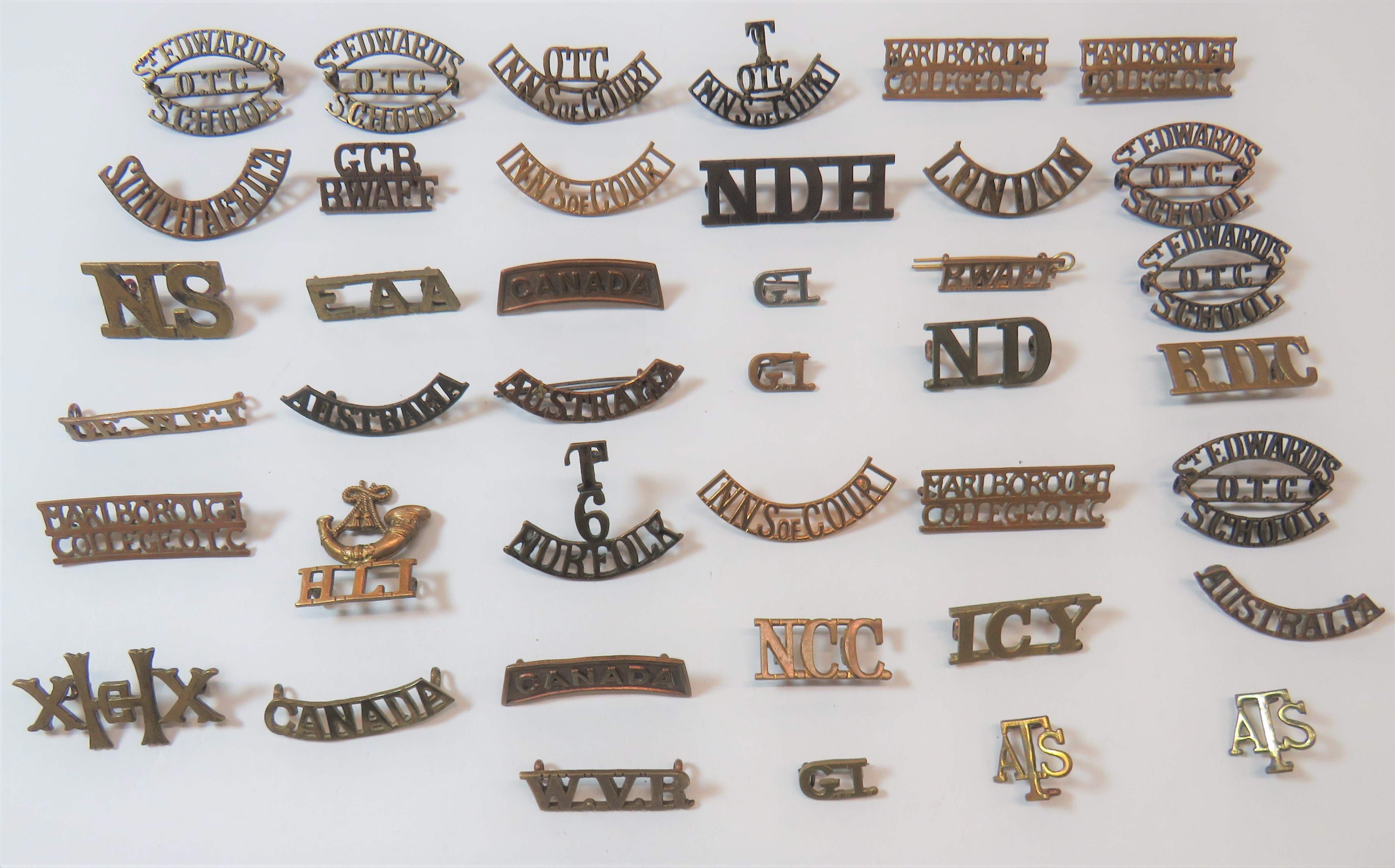 Various Brass Shoulder Titles including EAA ... Canada ... RWAFF ... Australia ... South