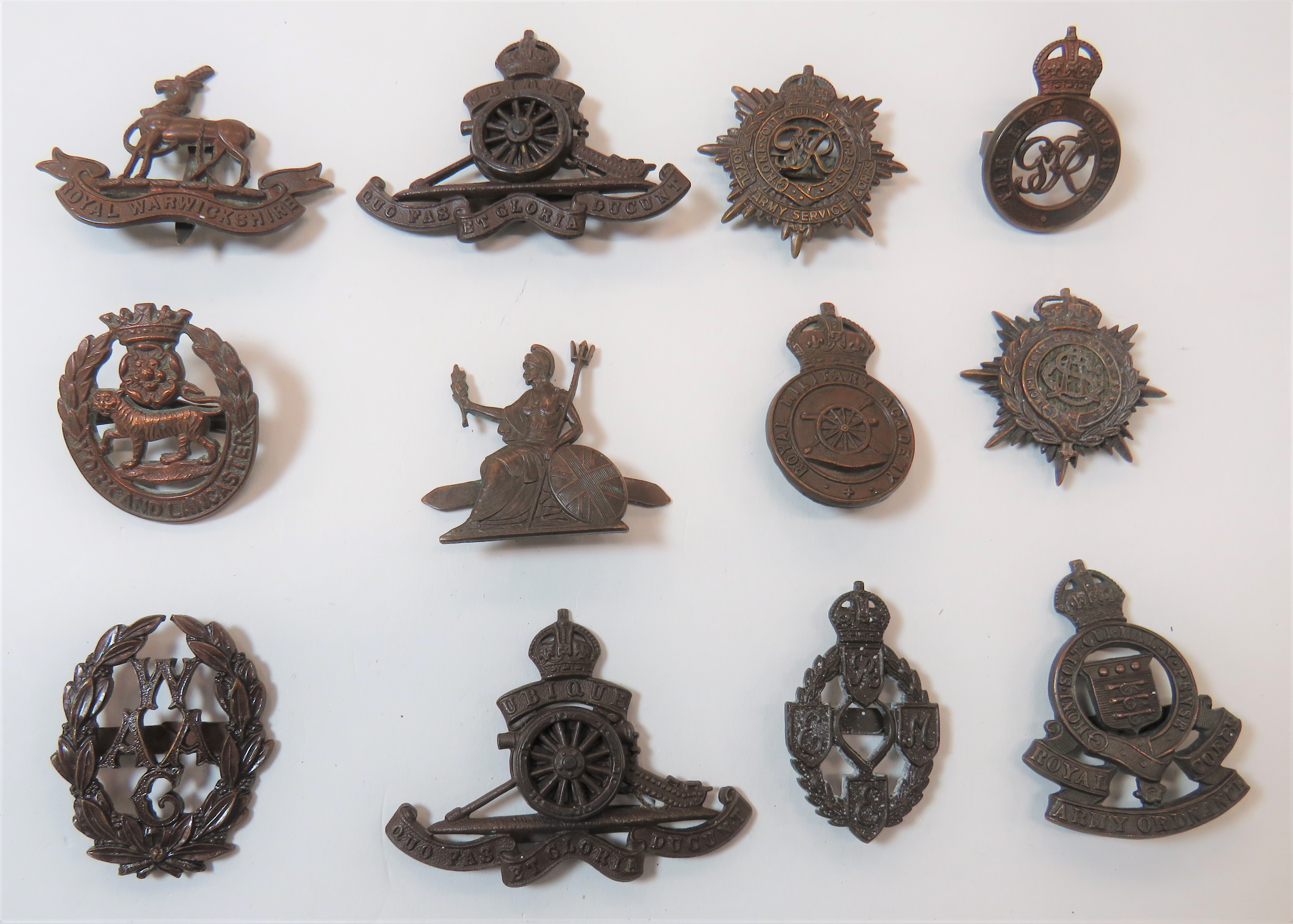 Officer Cap Badges consisting bronzed WAAC ... Bronzed Norfolk Reg ... Bronzed KC The Life