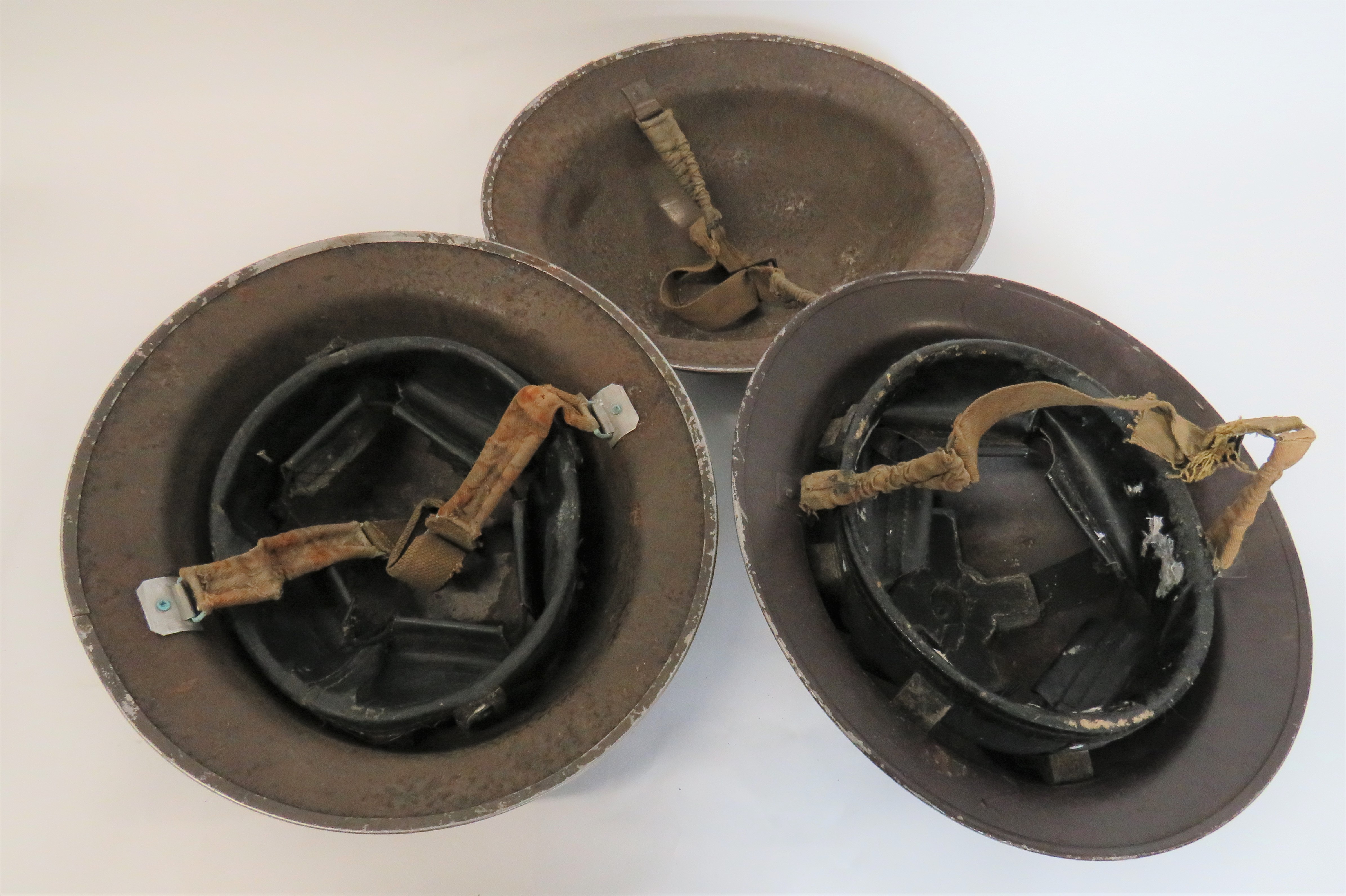 Three British Steel Helmets consisting brown painted shell.  Black treated linen liner.  Frame - Image 2 of 2