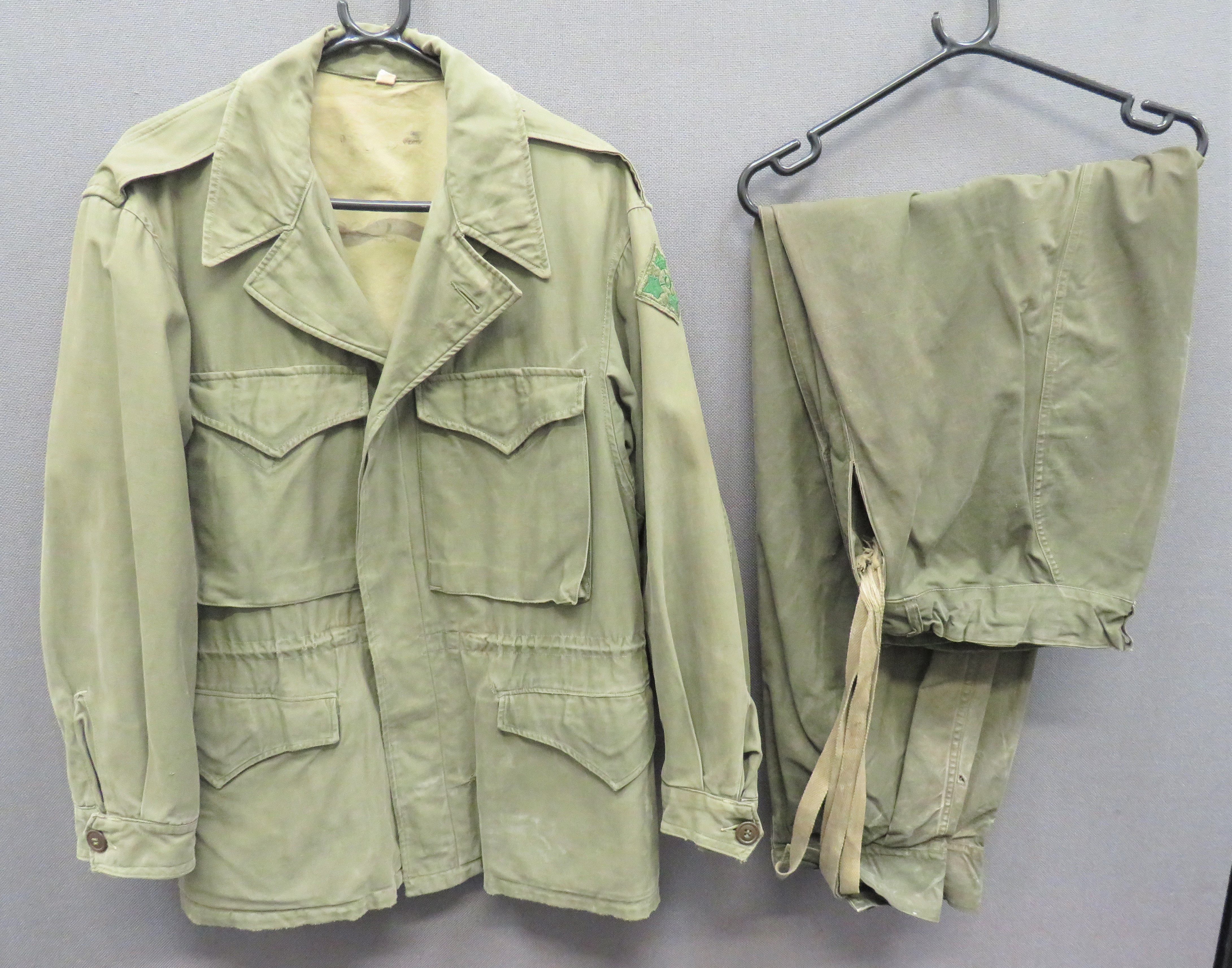 American M1943 Field Jacket green, heavy cotton, single breasted jacket.  The front fastened by