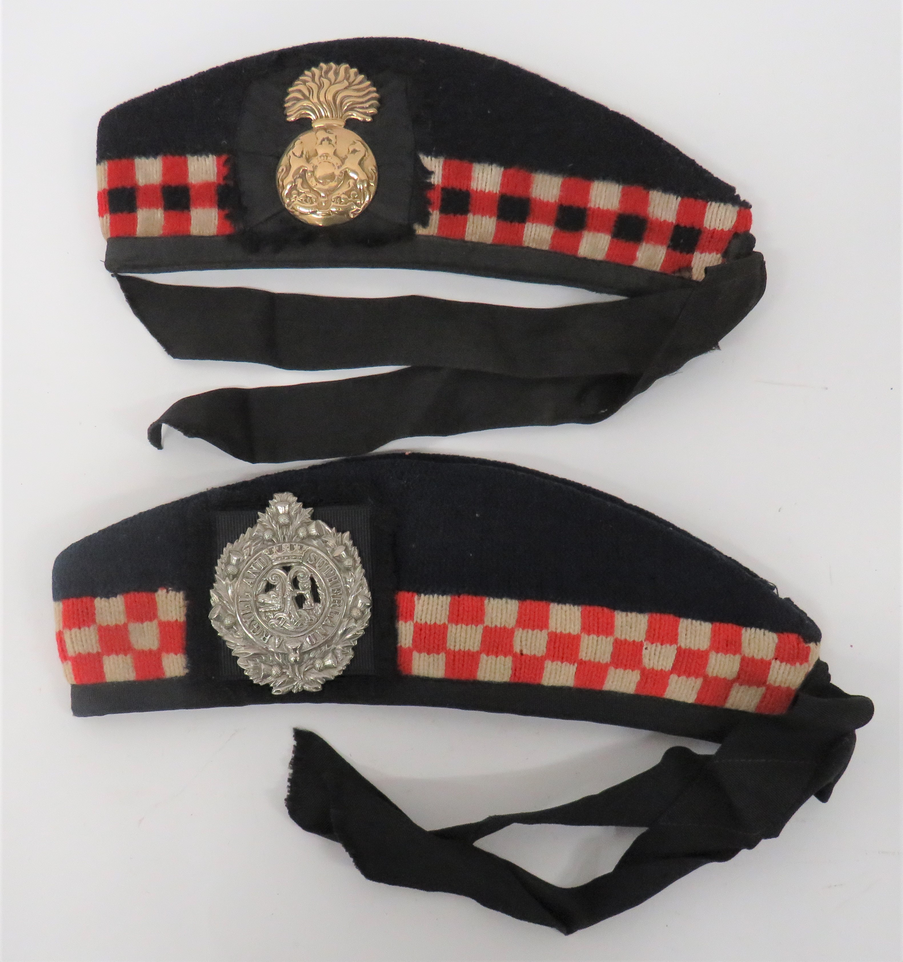 Two Scottish Glengarry Hats consisting A & SH example.  Dark blue crown and body with lower red