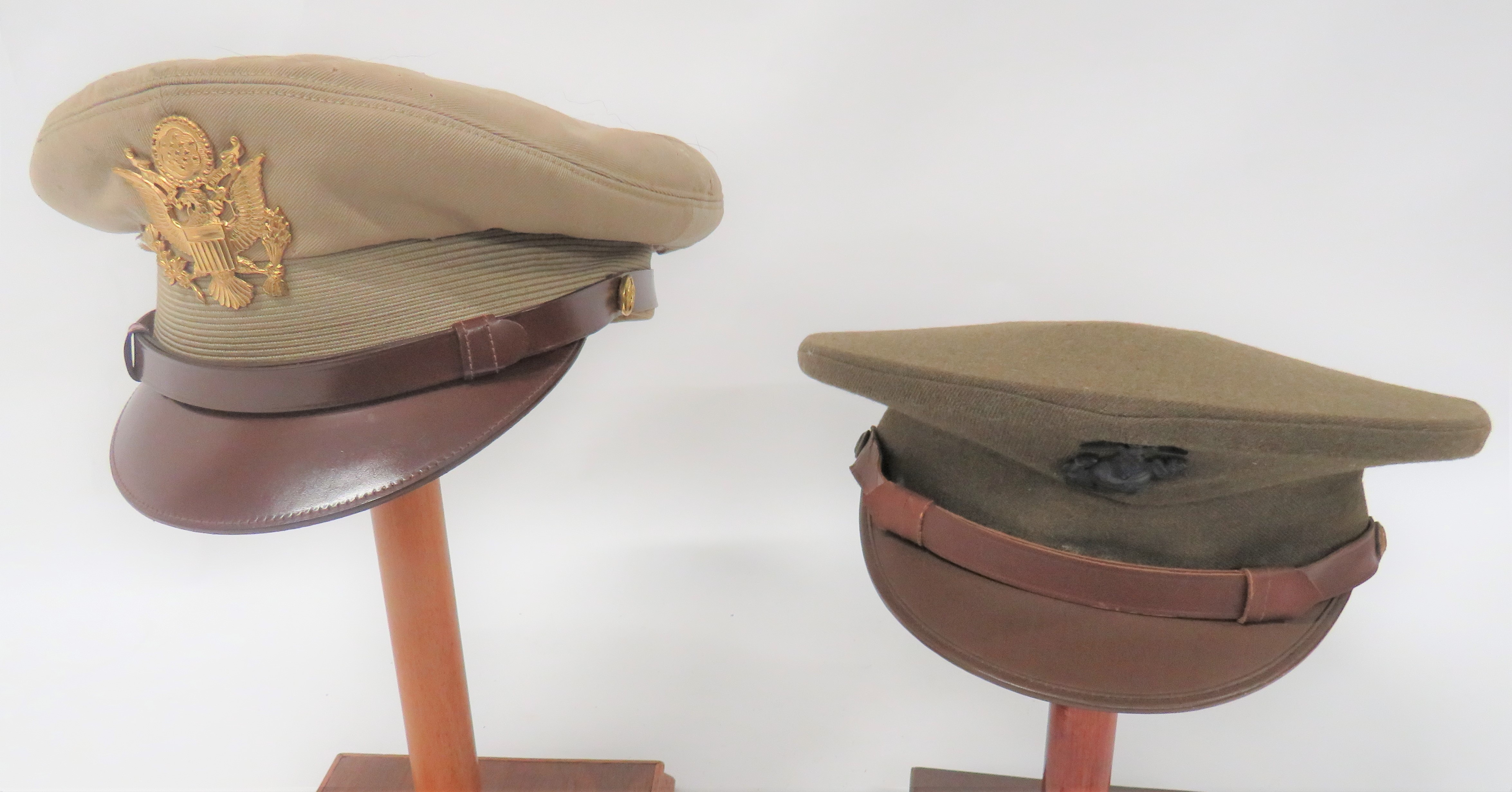 Two American Caps consisting USMC khaki service dress cap.  Brown leatherette peak.  Brown leather