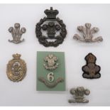 7 Welsh Orientated Badges including cast brass, Vic crown Royal Brecknockshire Rifles.  Fitting