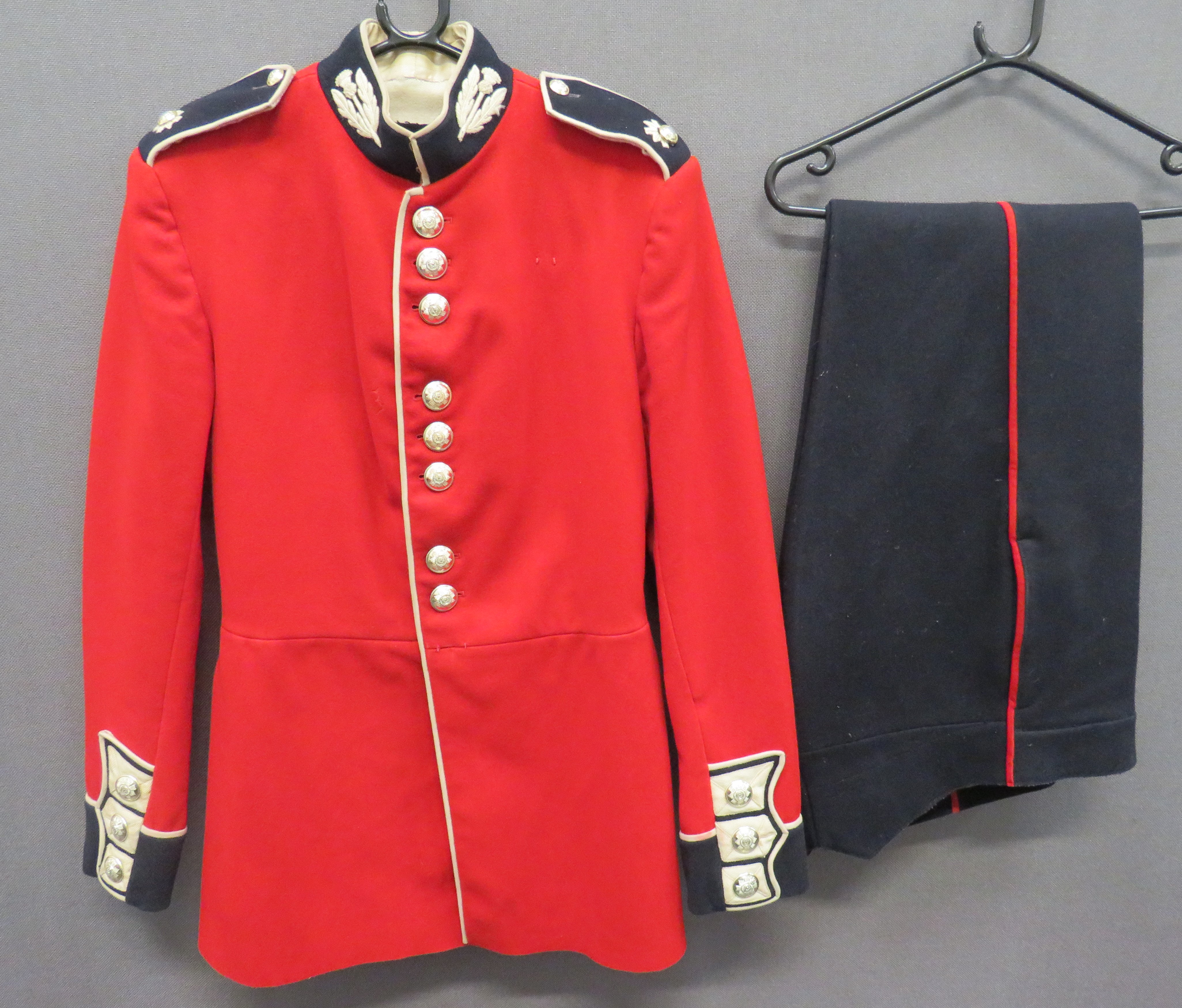Current Scots Guards Guardsman Tunic scarlet, single breasted tunic.  Black collar with white piping
