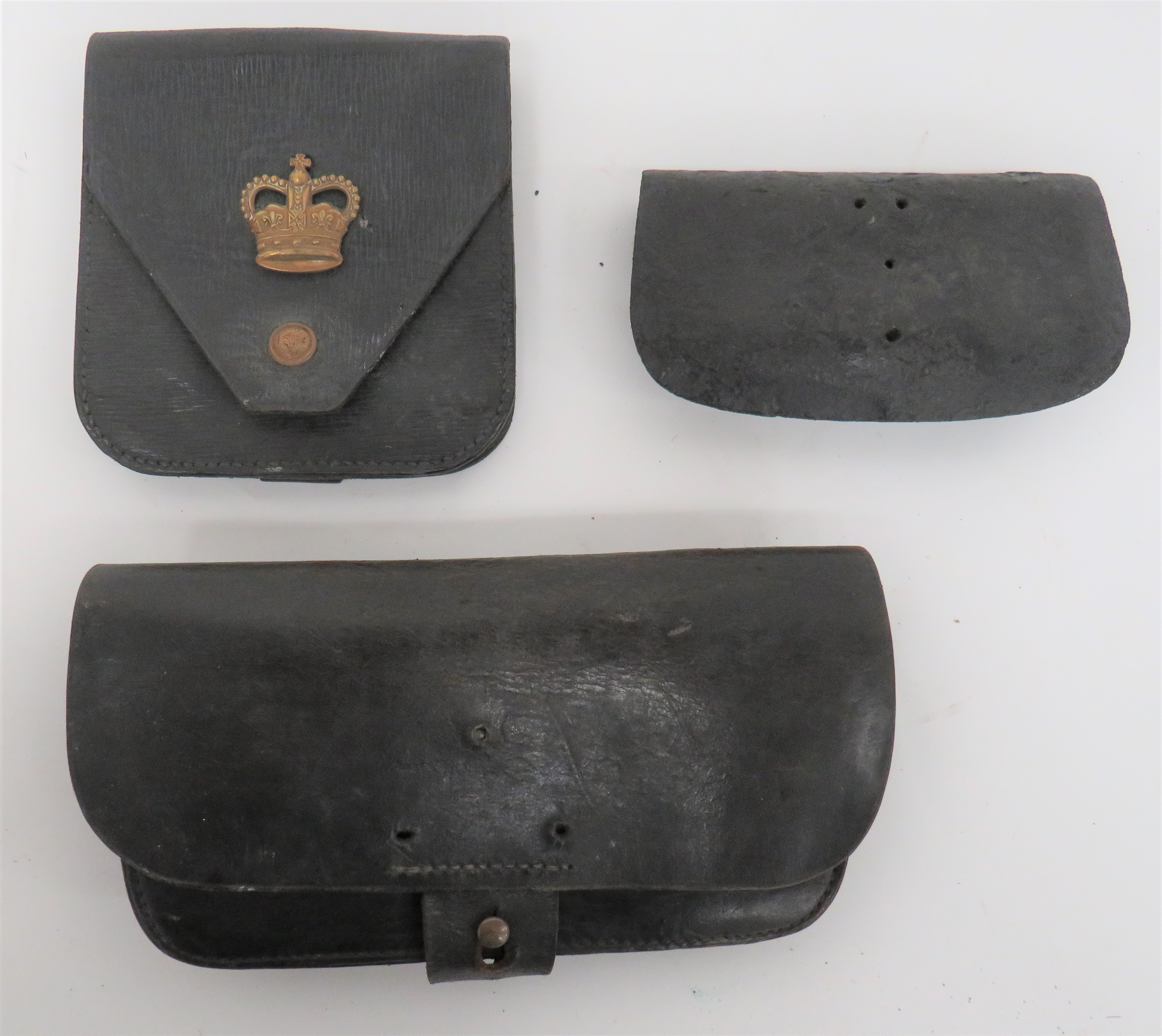 Three Various Leather Pouches  consisting black patent leather pouch.  Full front flap.  Badge and