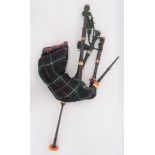 Set Of Scottish Bagpipes tartan covered leather wind bag.  Lower turned wooden chanter.  Turned