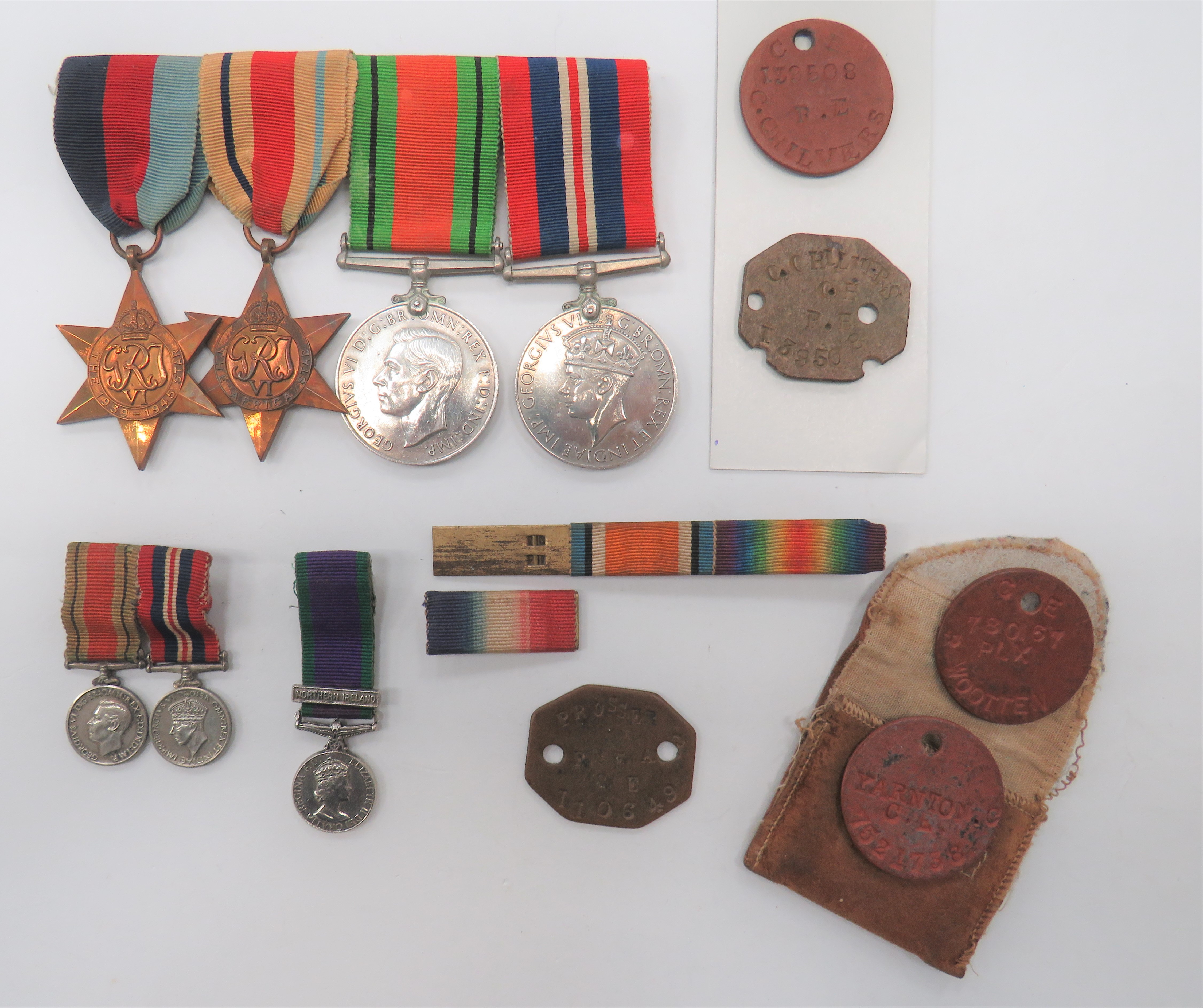 WW2 Medal Group And ID Tags consisting 1939/45 Star, Africa Star, Defence medal, War medal.  Mounted