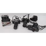 Three Minolta Cameras consisting Model SRT101 with Hoya 52mm Skylight lens ... Model XE-5 with 50 mm