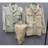 Two British Khaki Drill Jackets And Breeches consisting light khaki tan, single breasted tunic.