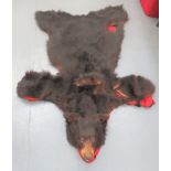 Vintage Taxidermy Bearskin Rug well done head.  Flat rug body.  Some damage.  Now mounted on a