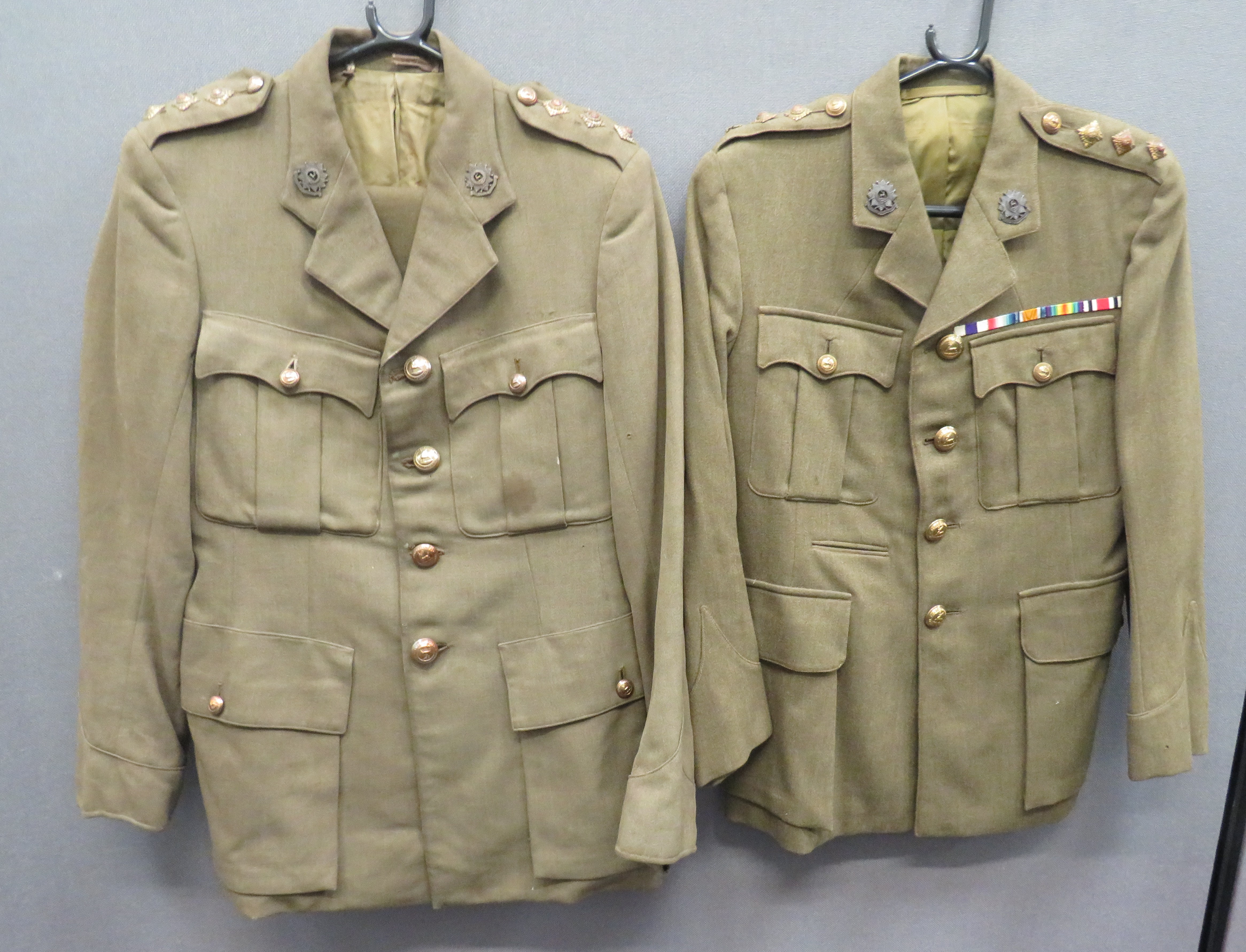 Two WW2 Bedfordshire And Hertfordshire Service Dress Tunics khaki, single breasted, open collar,