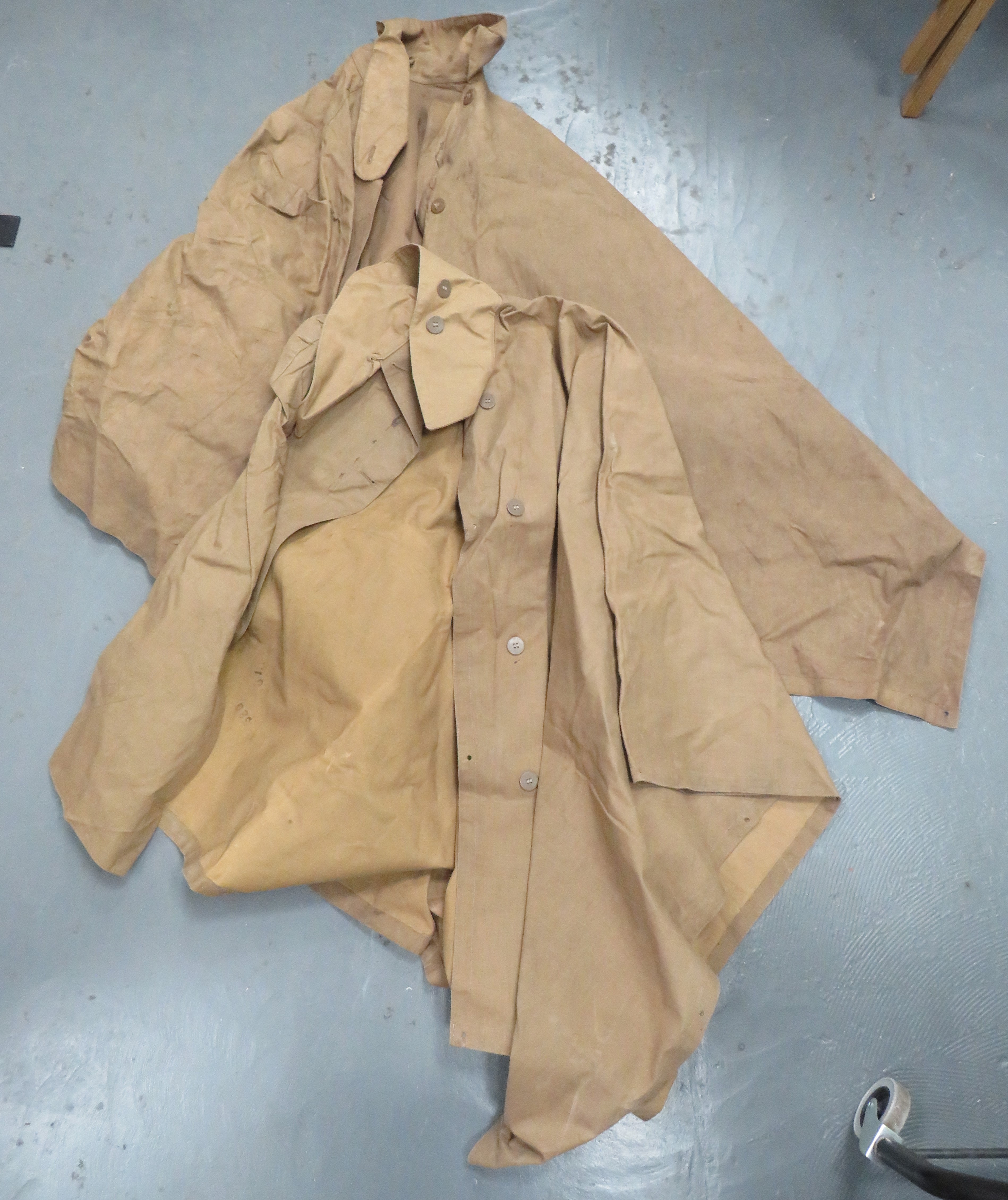 Two WW2 Waterproof Capes khaki, rubberised linen capes.  Large, fold over collar.  The front