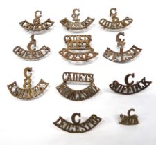 11 x Regimental Cadet Titles brass titles consist C6 E Surrey ... C8 E Surrey ... C4 Royal