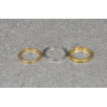 Two 22ct gold wedding rings and a platinum wedding ring two gold rings, weight 4.3g; platinum, 1.