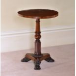 A William IV rosewood and brass circular occasional or wine table the brass strung top on a turned