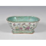 A Chinese famille rose footed dish Tongzhi mark and period, of waisted oval shaped form, painted