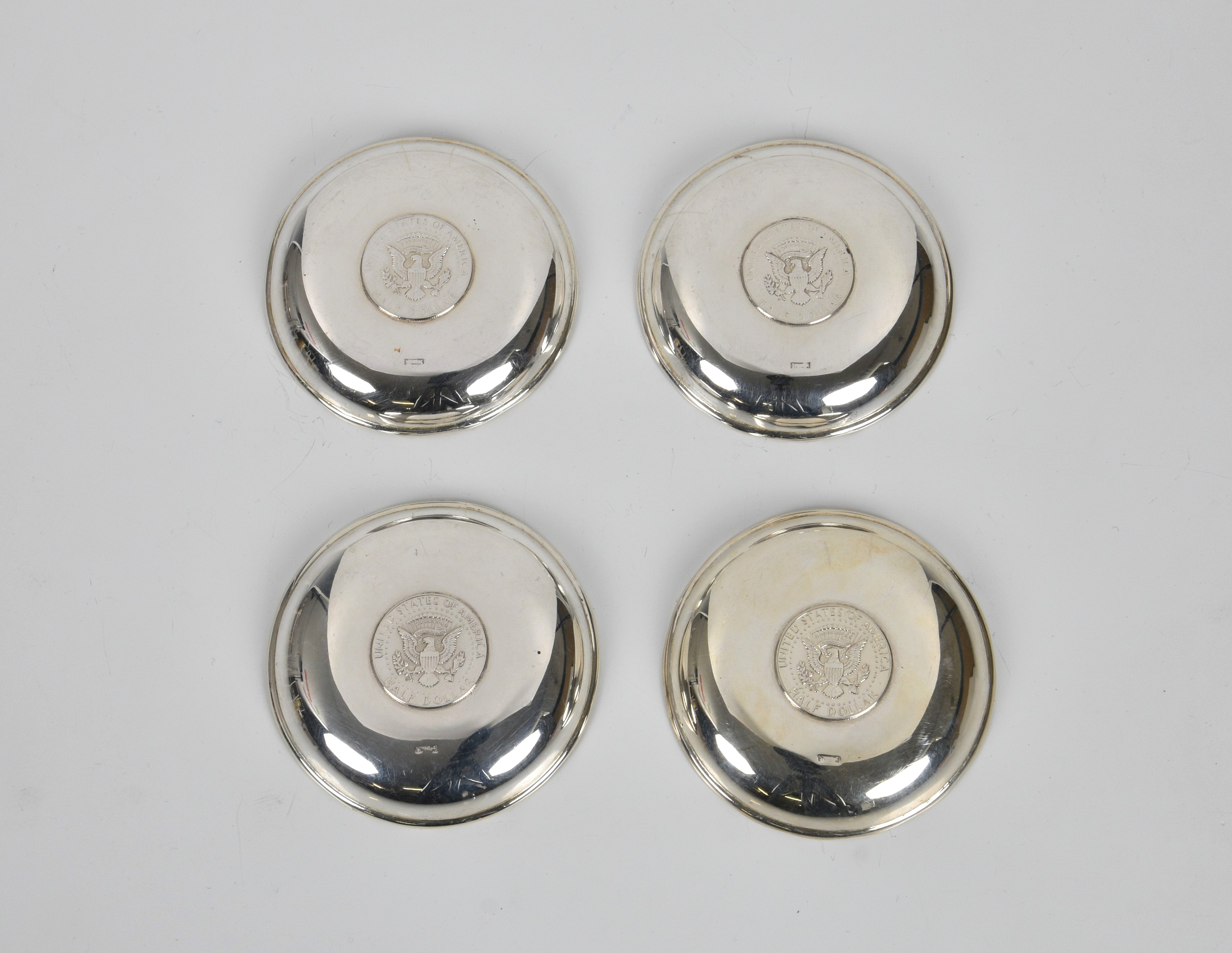 A set of four Hong Kong silver pin dishes by Wai Kee, with inset HK junk dollar coins, 3½in. (8. - Image 2 of 2