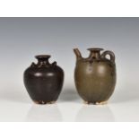 A Song Dynasty brown glazed Henan vase with four loop handles 6in. (15.3cm.) high, together with