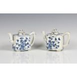 A closely matched pair of Qianlong period Chinese blue & white teapots painted with flowers, moulded