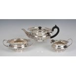 A good quality late Victorian silver three piece tea service Charles Stuart Harris, London, 1897,