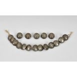 A collection of eighteen uniform or dress buttons featuring skep / beehive and bees, by Firmin,