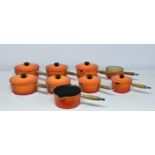 A Graduated set of four Le Creuset cast iron saucepans 6in. - 8½in., together with five others,