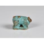 A Chinese miniature turquoise glazed dog probably Ming, 1 5/8in. (4cm.) long.* Condition: Small