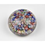 A dated Baccarat close-packed millefiori glass paperweight dated B 1848, comprising of numerous