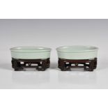 A pair of pale celadon glazed Chinese porcelain oval brush washers six character Yongzheng marks and