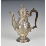 A good elegant George II silver baluster coffee pot John Swift, London, 1758, repoussé floral rococo