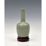 A Chinese Yuan style mallet shaped vase sooty grey mottled glaze, incised calligraphy to base, 7½in.