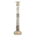 A marble pedestal, the gun barrel column on octagonal base 37½in. (95cm.) high.