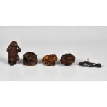 Four Japanese carved boxwood netsukes Edo / Meiji period, all signed, including a sleeping oni