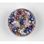 A 19th century Baccarat close-packed millefiori glass paperweight comprising of numerous assorted