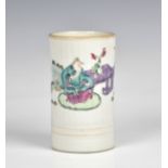 A Chinese famille rose cylindrical brush pot 19th century, painted with a scholar & attendant in