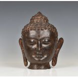 A modern antique style bronze bust of Buddha 12¼in. (31.2cm.) high.* Condition: nice patina.