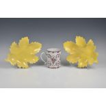 A pair of Continental Chinese-style yellow ground leaf shaped dishes (one restored), 11 3/8in. (