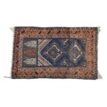 A small Baluch prayer rug 47¼ x 32in. (120 x 81.2cm.).* Condition: Faded and worn
