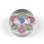 A St Louis floral millefiori and spiral latticinio glass paperweight the double white spiral