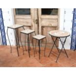 A graduated set of three mosaic and wrought iron lamp tables late 20th century, the largest 11in. (