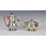 A George III silver teapot James McKay, Edinburgh, 1817, of half fluted squat circular form, to