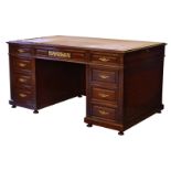 An Empire style mahogany double pedestal desk late 20th century, the moulded top with inset tan